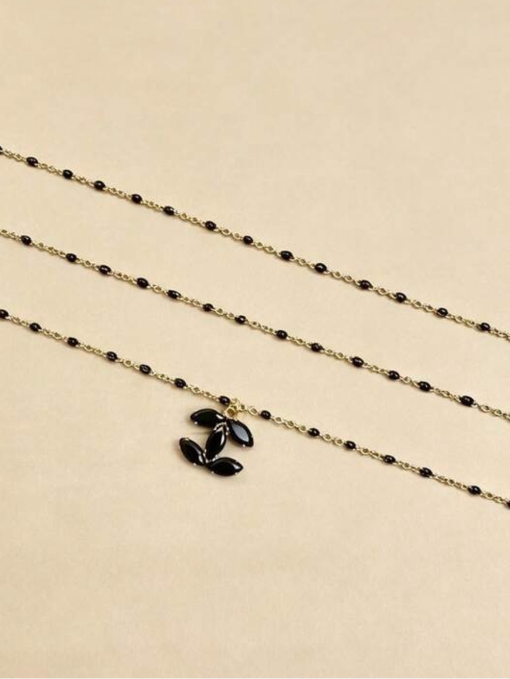 CC pendant on Gold and Black Beaded Set of 3 Layered Necklaces - Picture 2 of 3